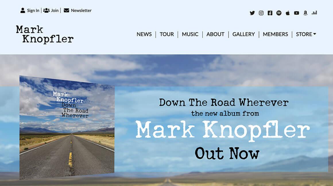 Screenshot of Mark Knopfler's 2019 website with a light blue colour theme. Photo of an empty road leading to the far-off horizon. Text reads Down the Road Wherever the new album from Mark Knopfler out now.